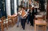 Στη γιορτή του Αγ. Γεωργίου στη Θερμή Λέσβου, στις 27/04/1996. Κομπανία  συνοδεύει την περιφορά του ταύρου. Διακρίνεται δεξιά ο μουσικός Βασίλης Παντελίδης (κλαρίνο).