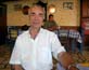 Ο μουσικός Μανόλης Βουρλιώτης (ακορντεόν, αρμόνιο), στο καφενείο - ταβέρνα «Το καλντερίμι», στην πλατεία των Μυτιληνιών Σάμου, στις 27/07/06.