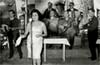 Στο Βροντάδο Χίου περίπου τη δεκαετία του 1960, στο κέντρο διασκέδασης «Τρεις Μύλοι». Διακρίνονται οι μουσικοί από αριστερά προς τα δεξιά: Νίκος Ντουβαλέτας (μπουζούκι), Ντεφίκ (τραγουδίστρια από την Τουρκία), άγνωστος (κλαρίνο), Ηλίας Εγγλέζος (κιθάρα, τραγούδι), Γιάννης Κοντογιάννης (βιολί). Πίσω σειρά: Στέλιος Νεαμονιτάκης (ντραμς), Παντελής Φιστές (ακορντεόν).
